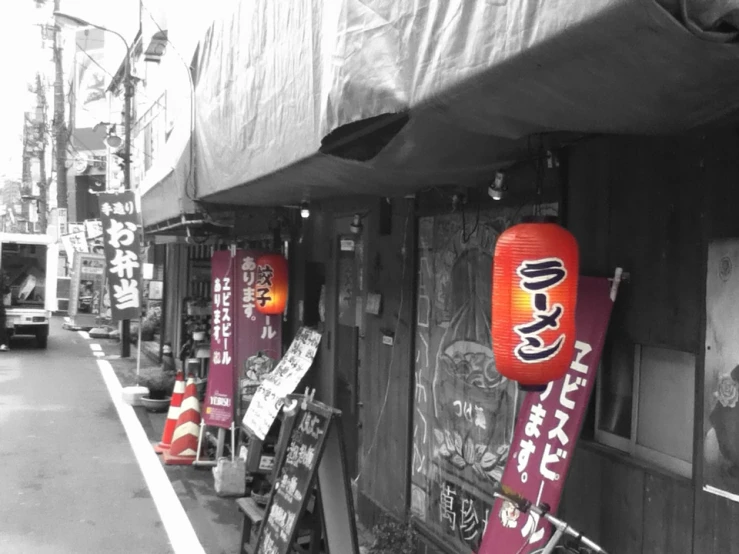 a row of red signs in front of storefront