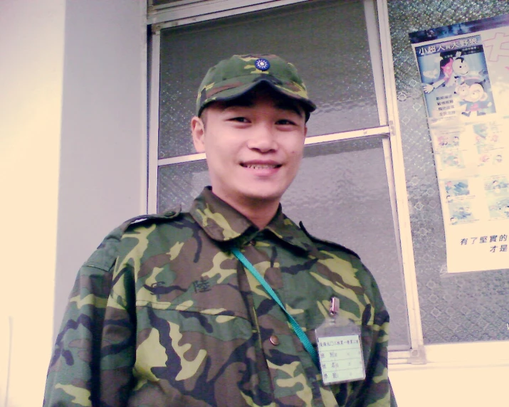 man in uniform standing in front of door