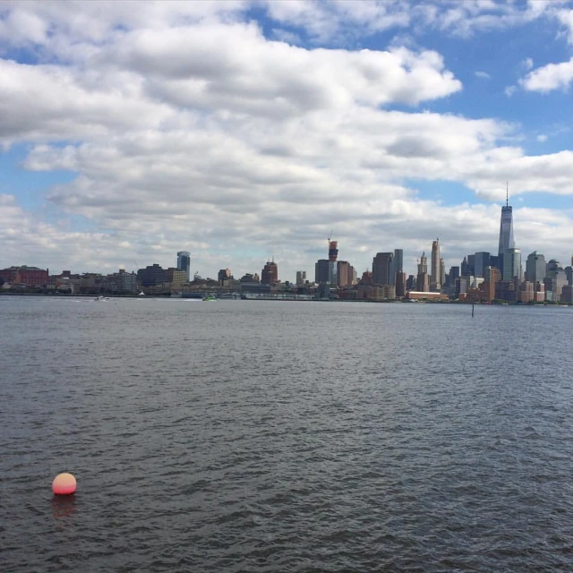 a large body of water near the city skyline