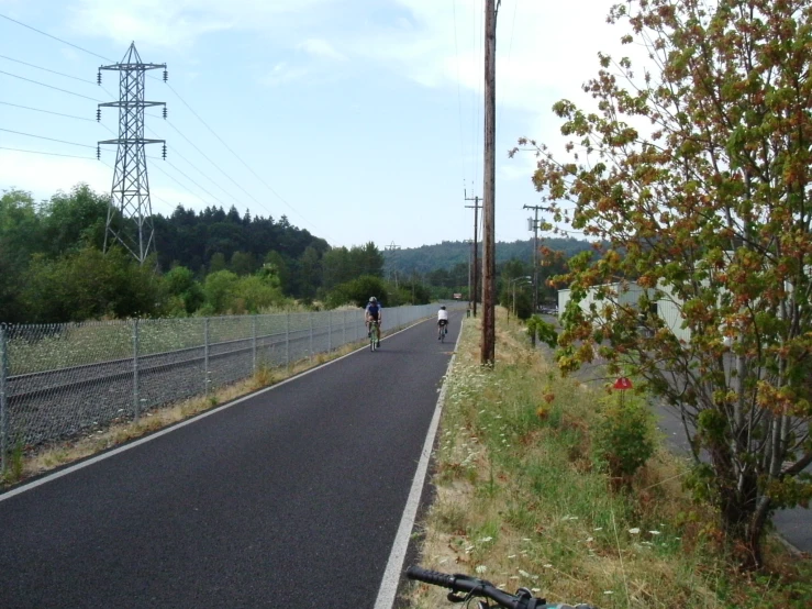 a person riding a bike on a road