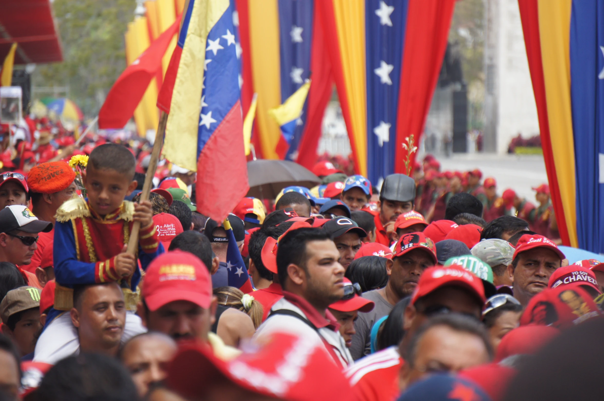 a group of people wearing red hats at a parade