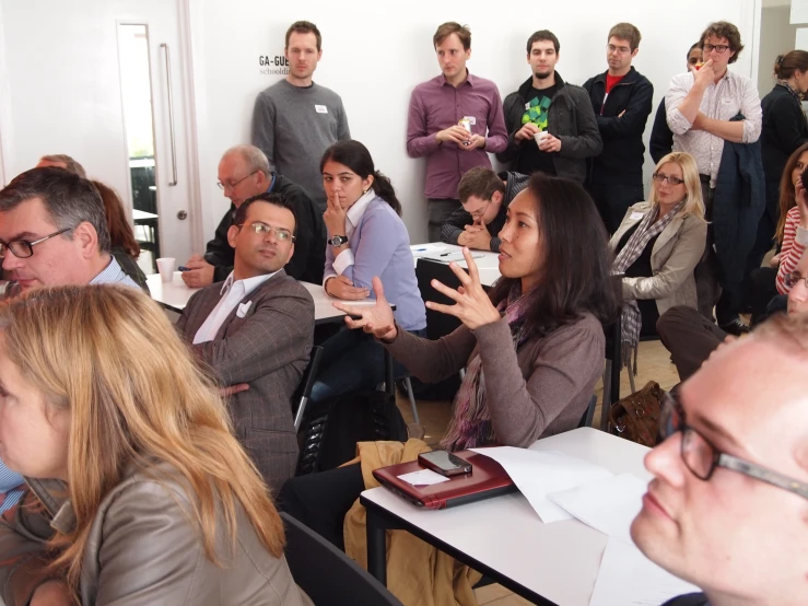 a group of people taking pictures in a room