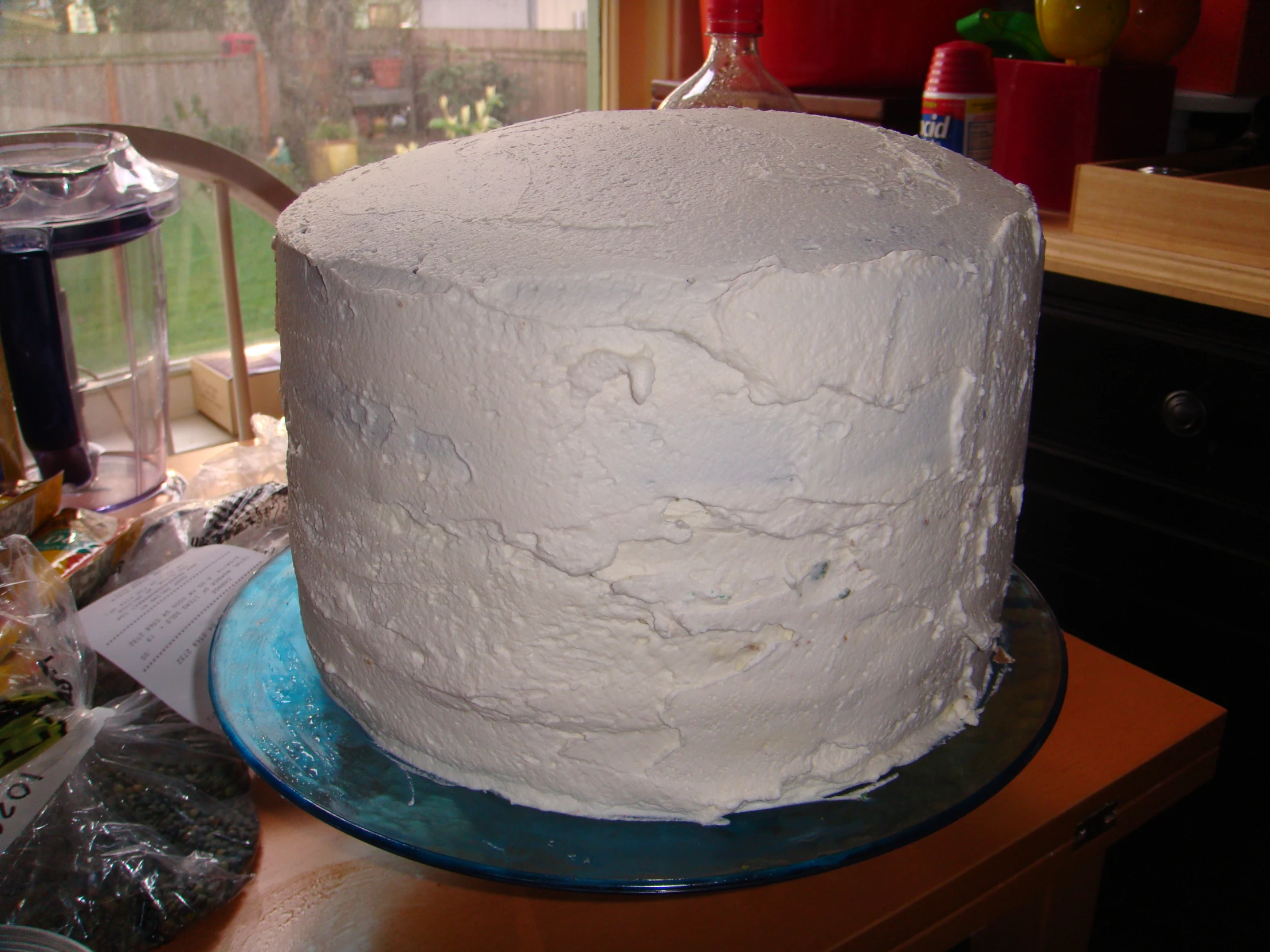 an image of a cake with white frosting