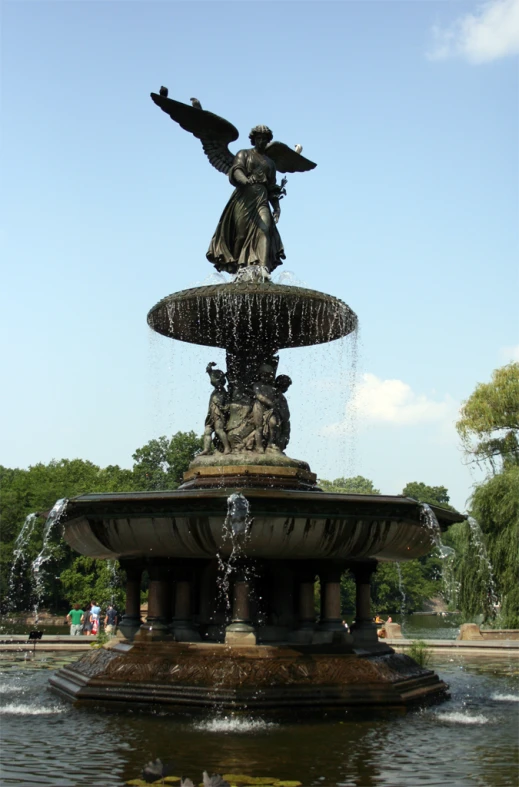 a water fountain with two angel statues on each of it