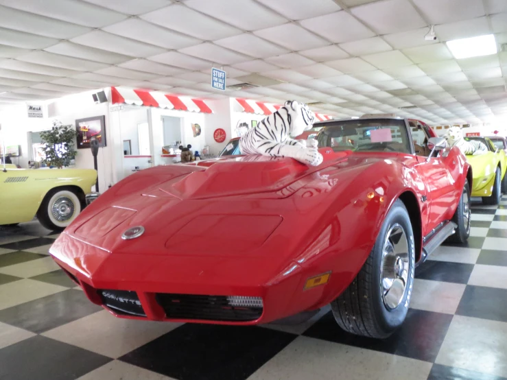 a car is parked inside of a large garage