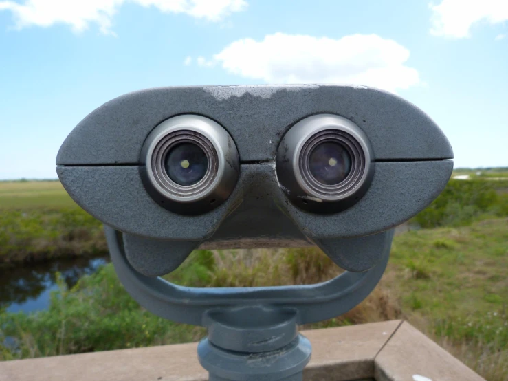 two binoculars set to look up into the sky