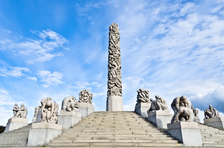 a monument with various statues and steps up to the top