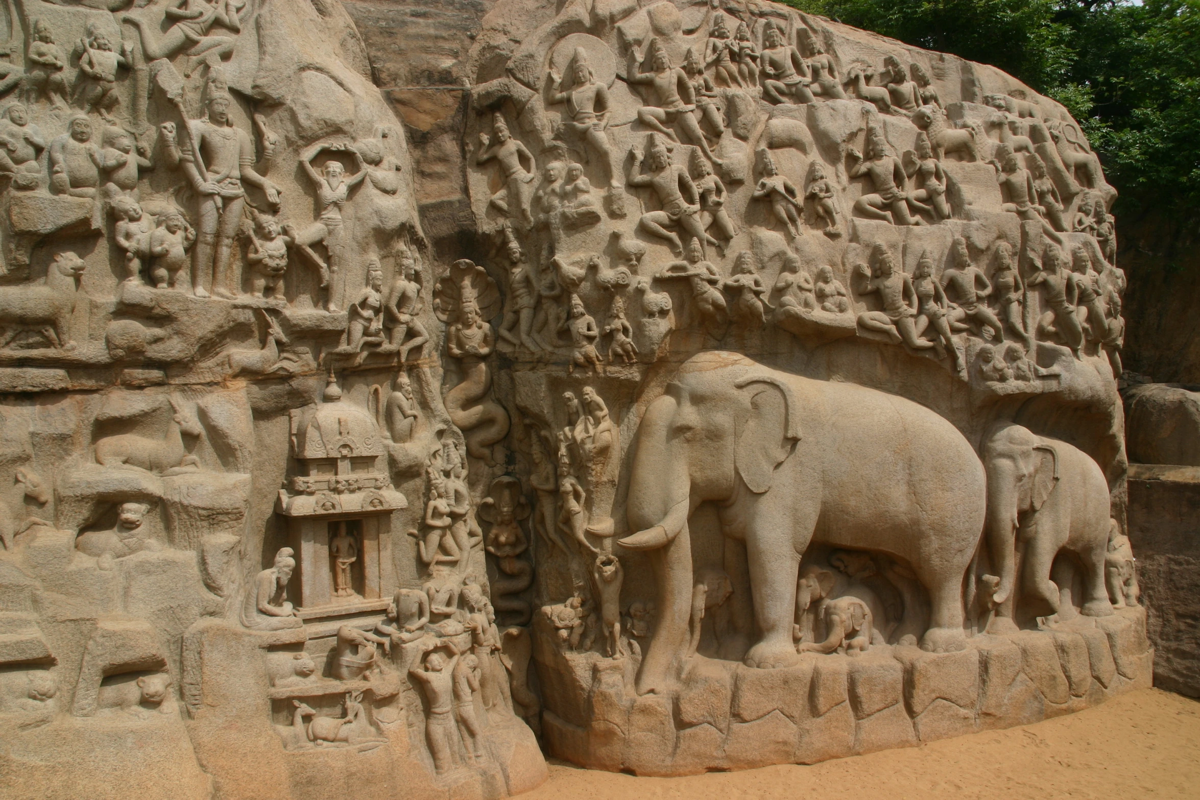 the carvings in the rock face are depicting elephants