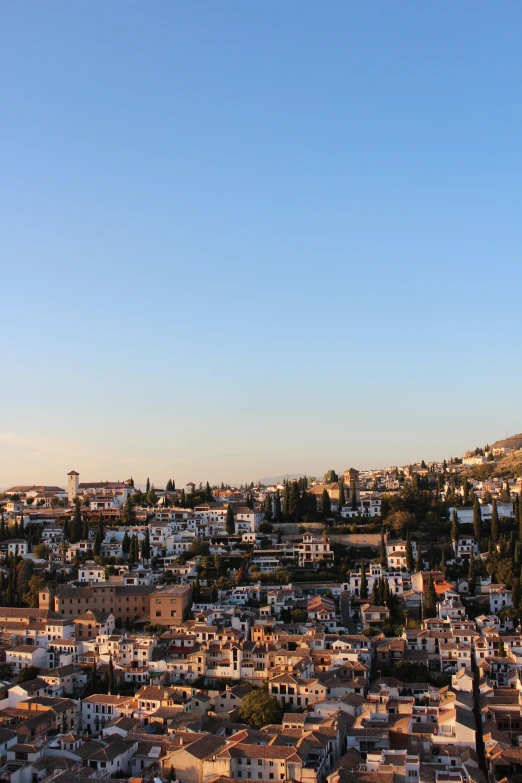 there is a view of the city, with a small hill in the background