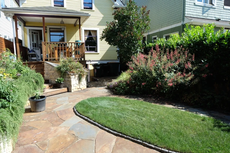 a lawn is sitting near the house with a green front yard