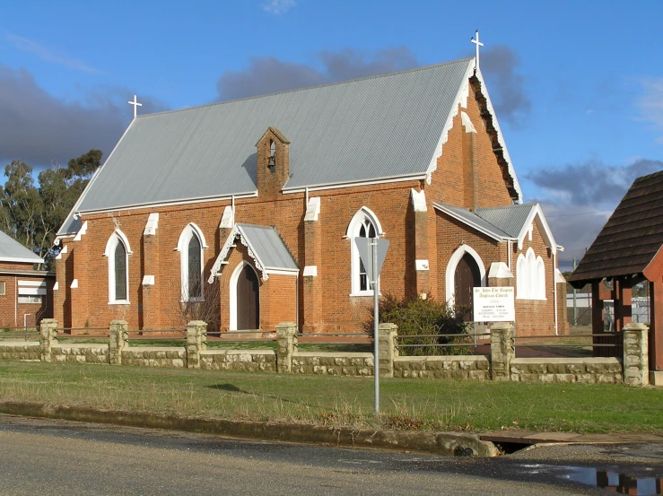 a brick church is shown with its red walls