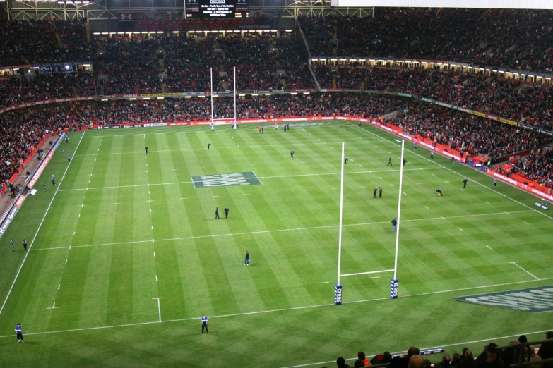 a soccer field with many people playing a game