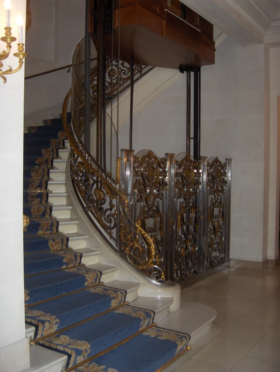 a golden railing surrounds the stairs of a house