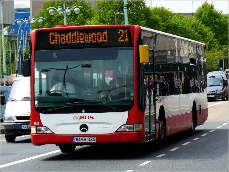 a bus on a street going down a street