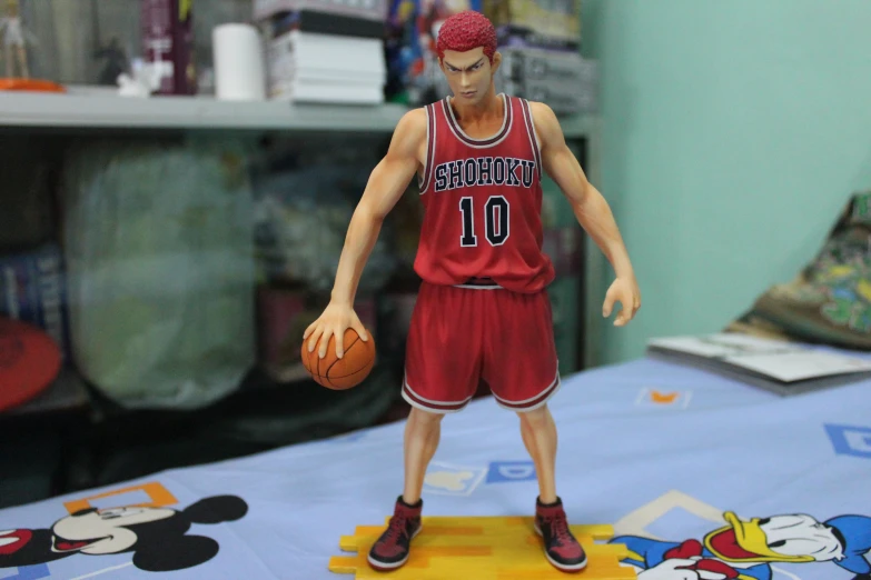 action figure of a basketball player and his mouse