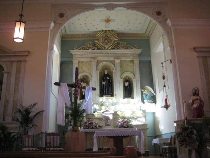 an empty church with flowers in the windows