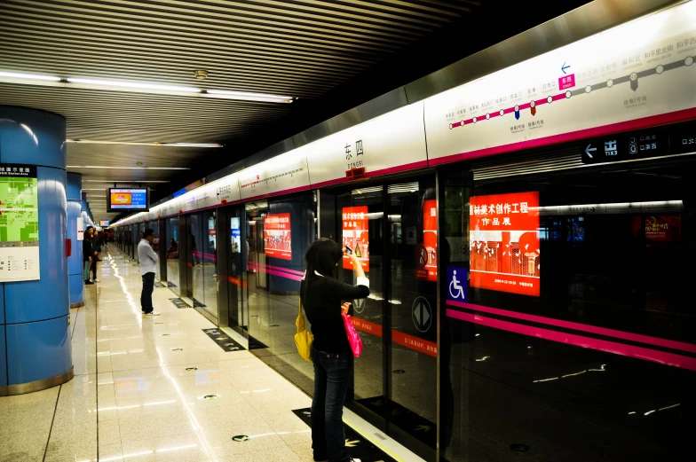 there is a woman leaning on the train