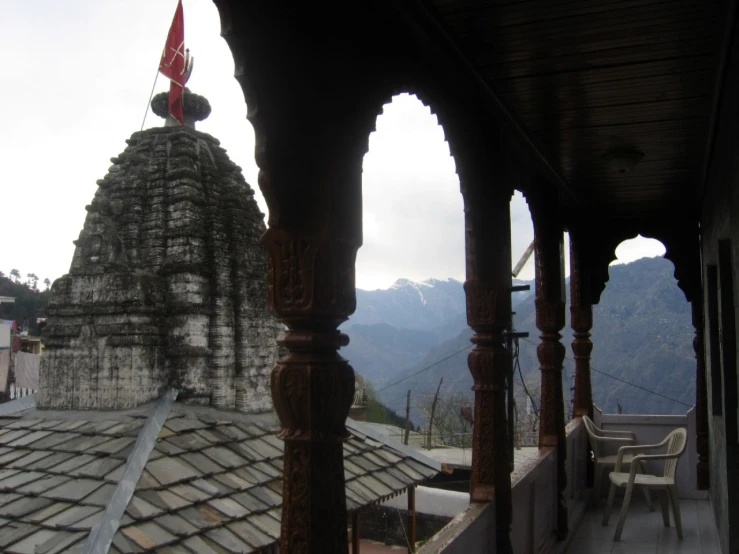 an indian styled temple on the top of a hill