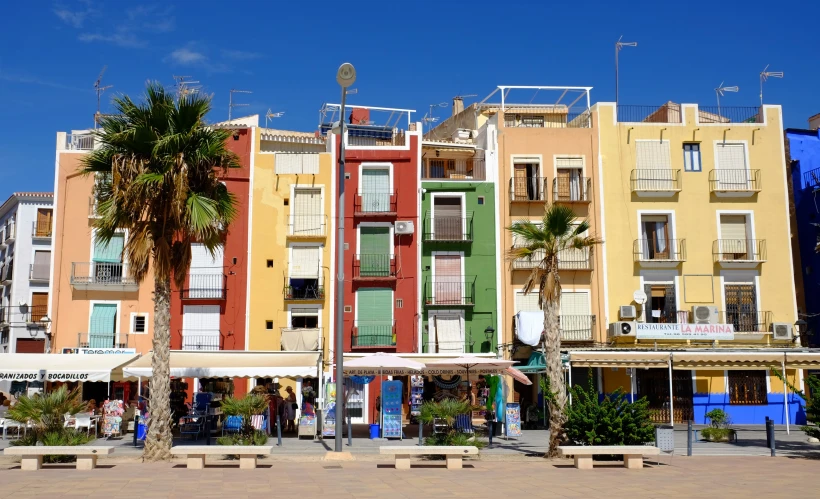 an image of multi - colored buildings on the beach