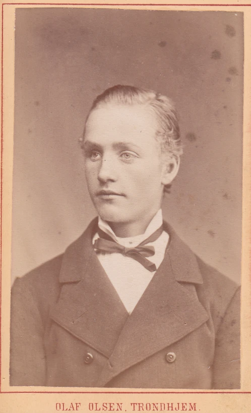 an old picture of a man with a bow tie