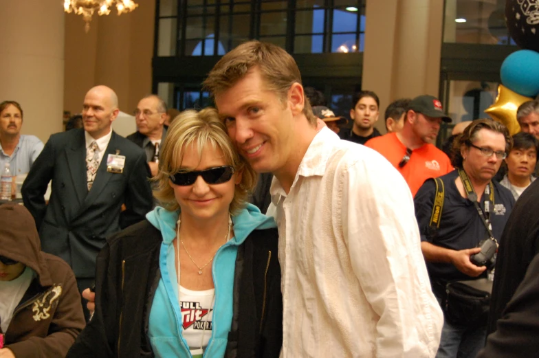 a man and a woman smiling for the camera