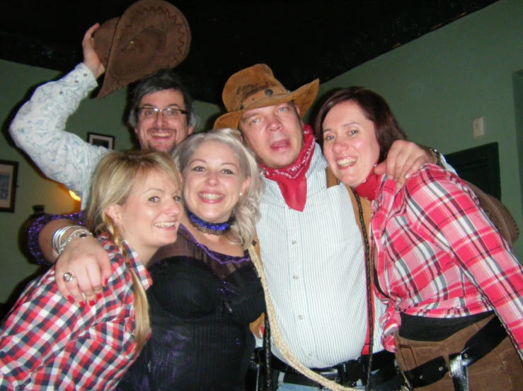 a group of people that are wearing western outfits