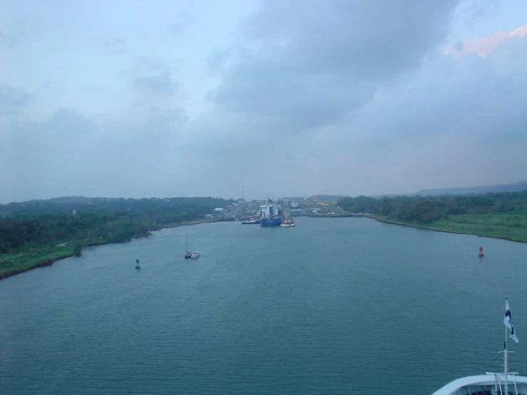 a harbor on the water with ships out in the background