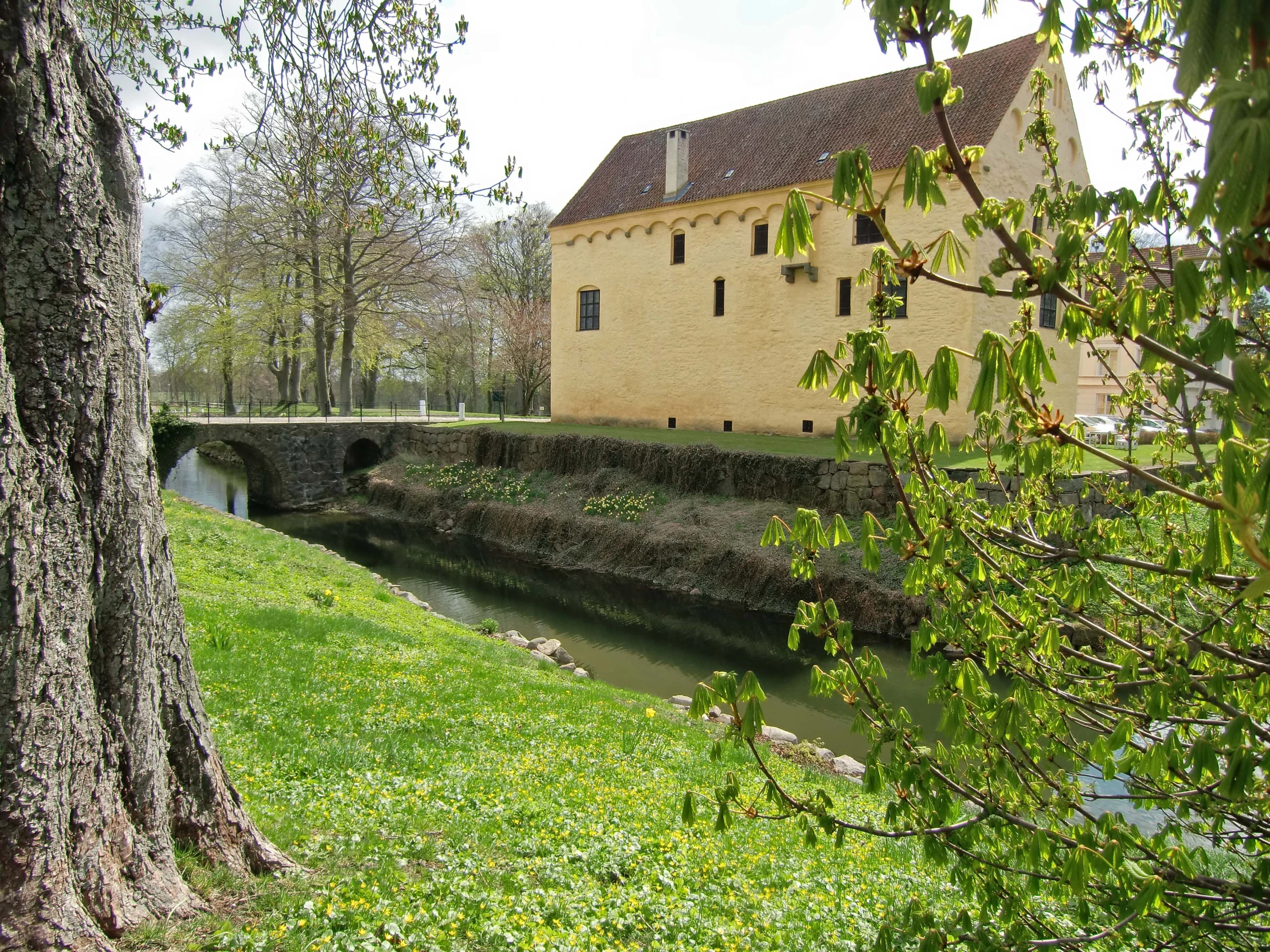 a castle like building with an overhang and windows