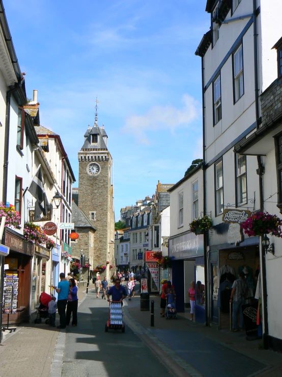 an old town with people walking down the streets