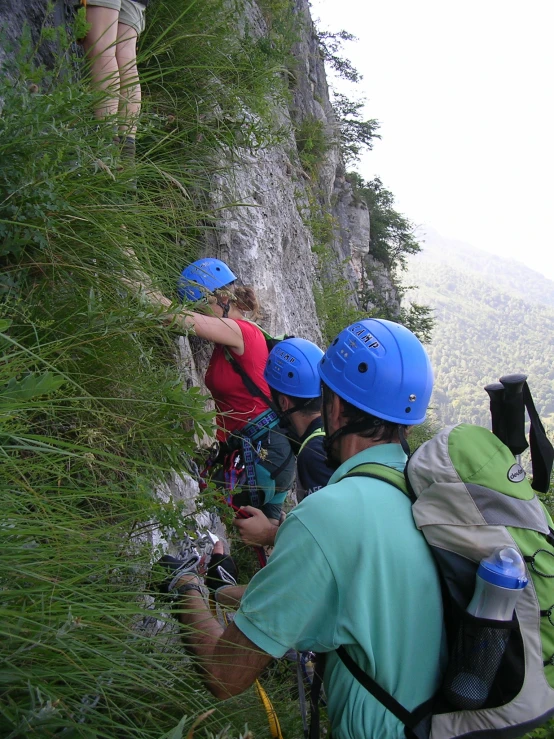 the backpackers hike down the mountain to reach the top