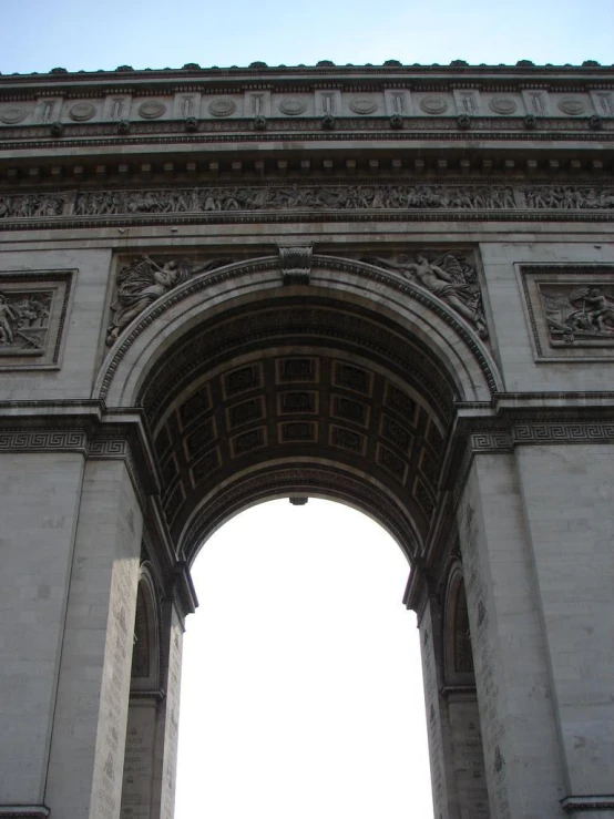 an arch has ornate carvings above it on top