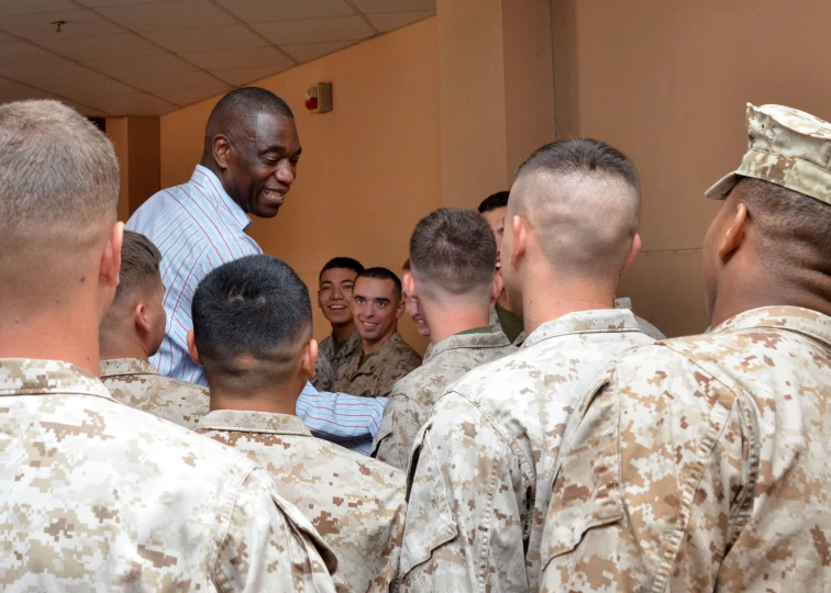 a soldier standing in front of a group of soldiers