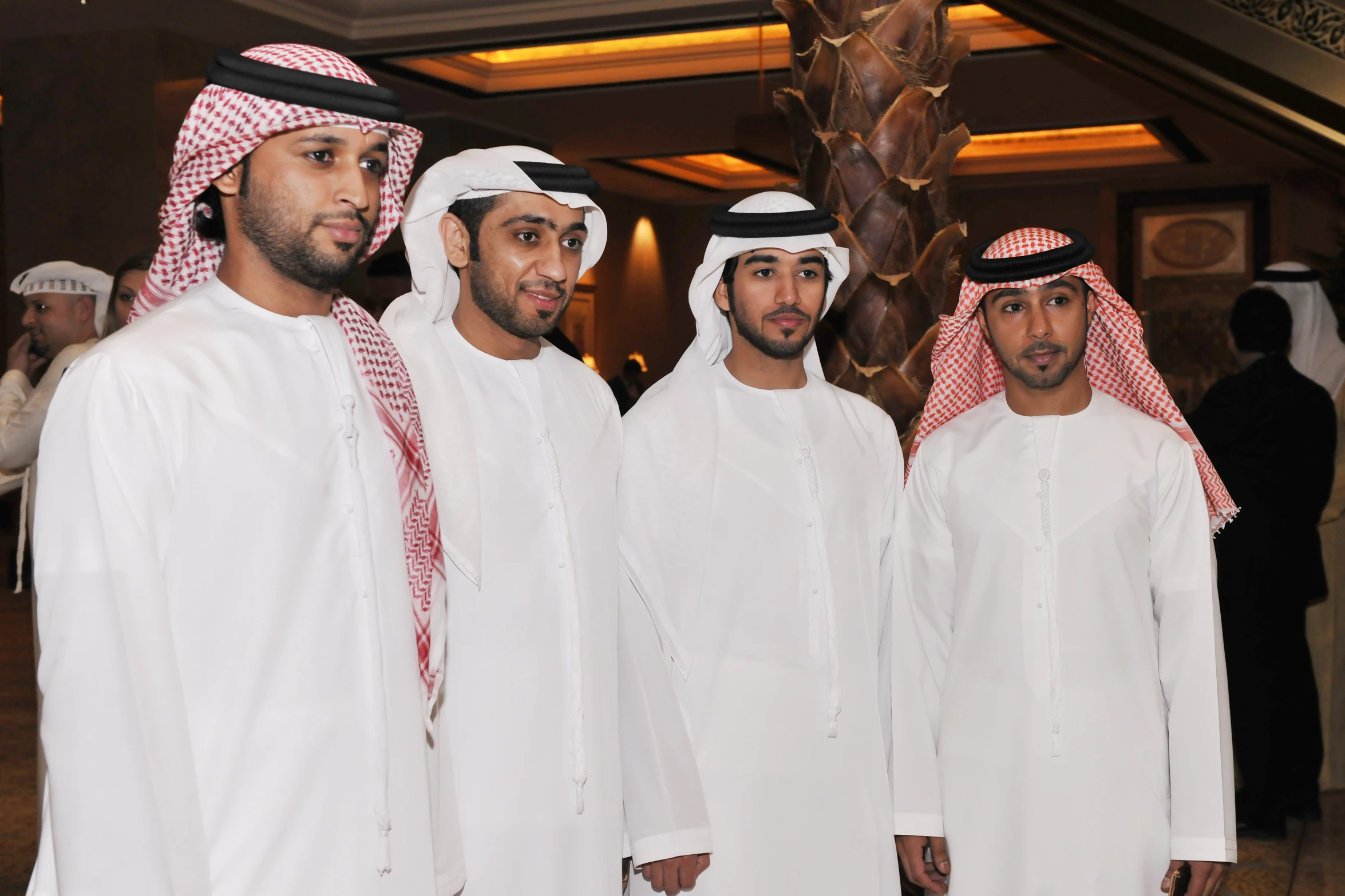 six men in traditional attire standing next to each other