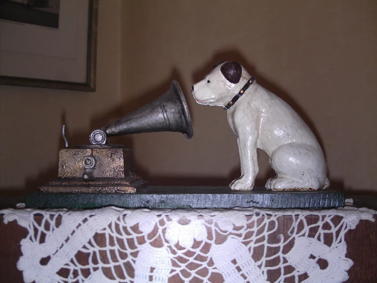 a small dog that is sitting next to a desk