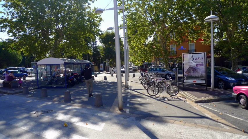 two bicycles are parked on the side of the road