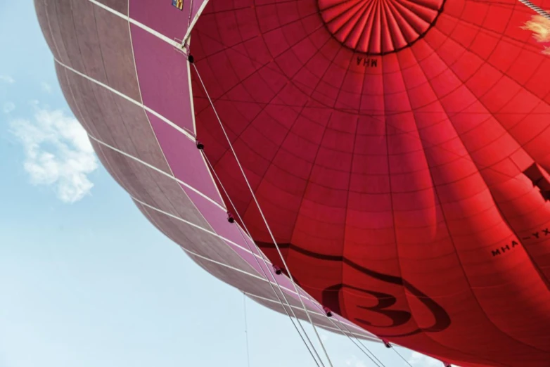 some very big colorful balloons flying in the sky