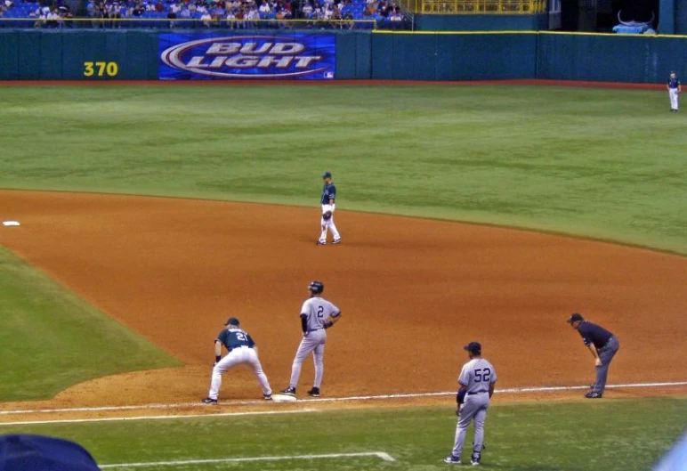 the baseball players are playing a game on the field