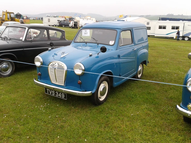 two classic trucks at an outdoor show