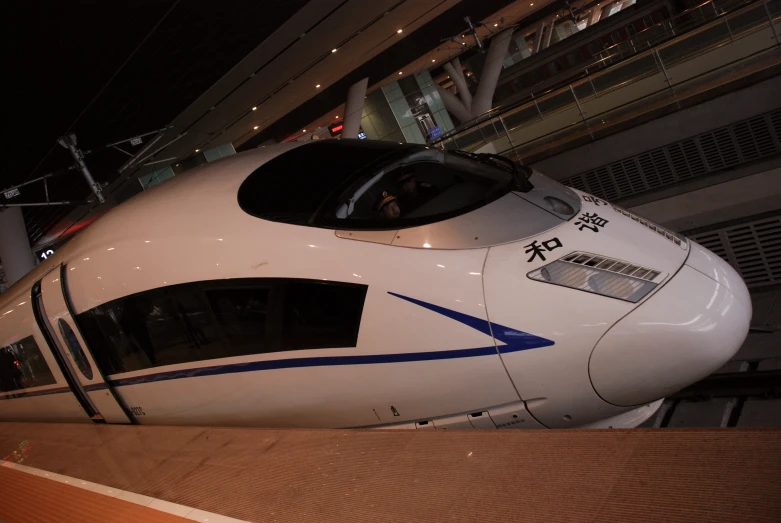 a modern high speed train inside of a building