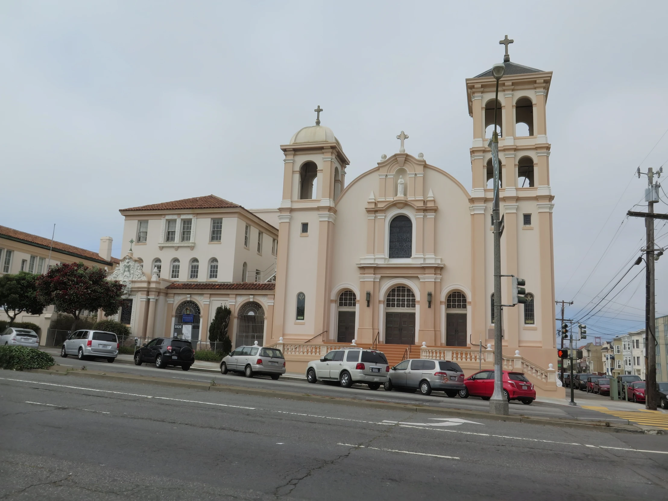 there are cars parked outside of the church