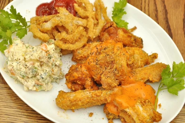 a plate with some fried food on top of it