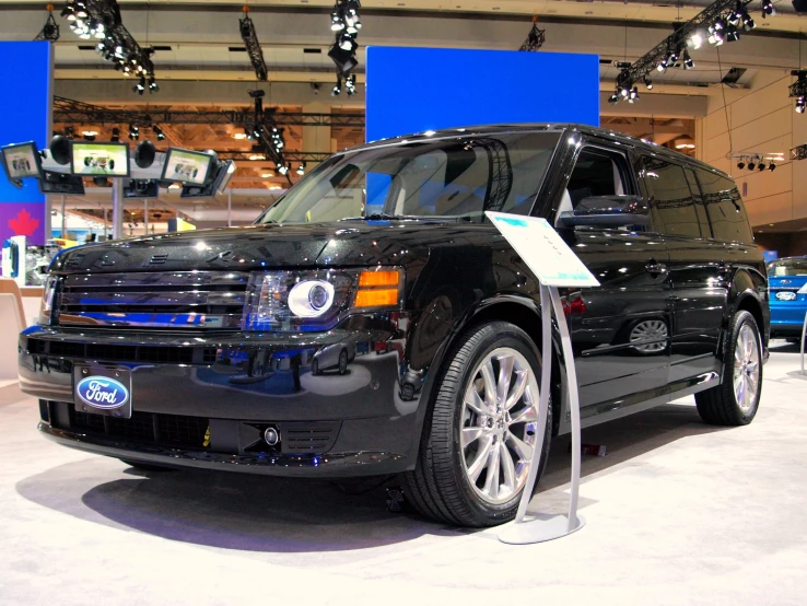 a black ford expedition van is on display