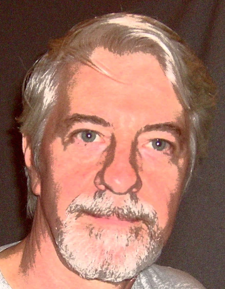 a man in a white shirt and gray hair