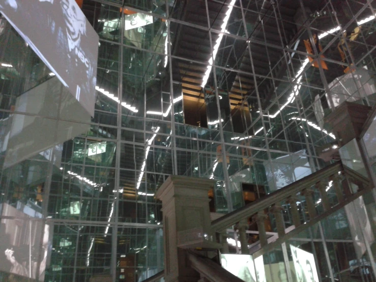 the staircase is surrounded by a glass and steel wall