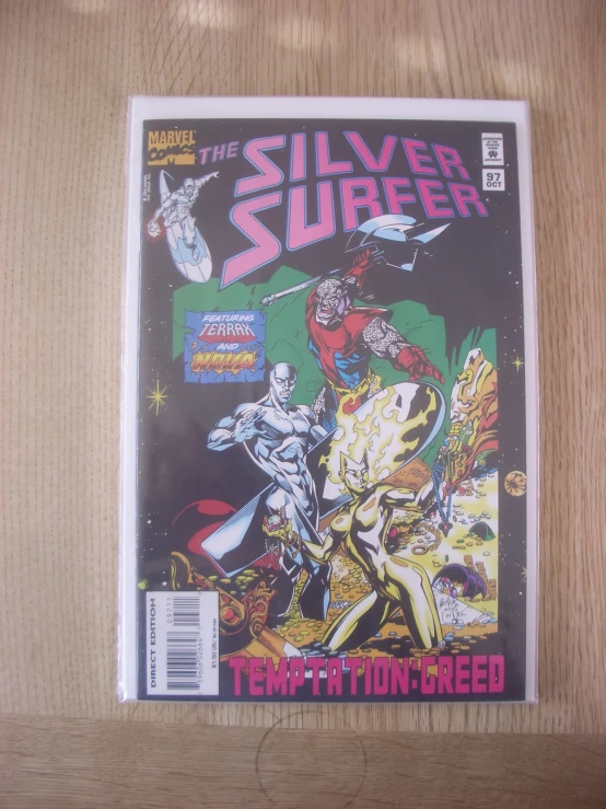 the silver surfer comic cover is on a table