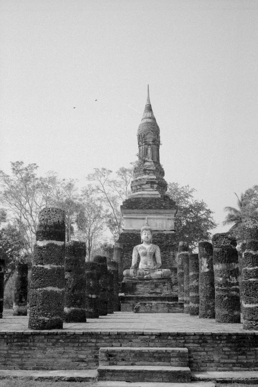 a black and white po with an ancient monument