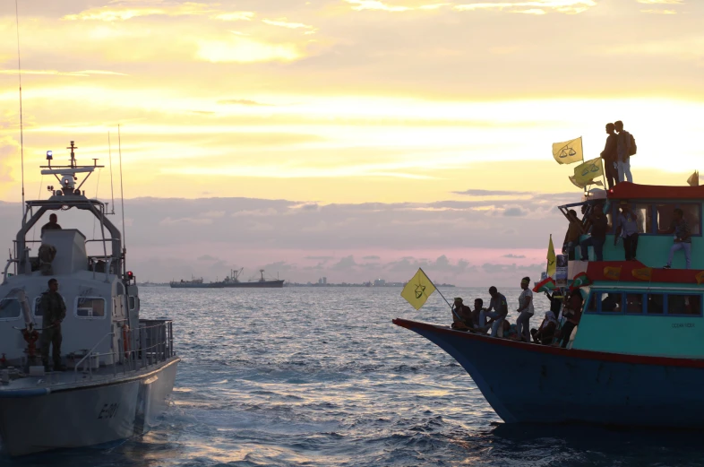 a boat full of people sailing out on the water