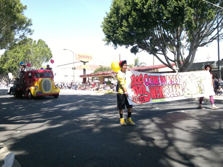 two women holding a sign with words and balloons