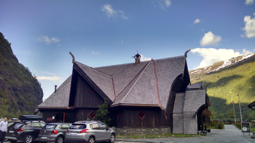 two people are on the roof of this church