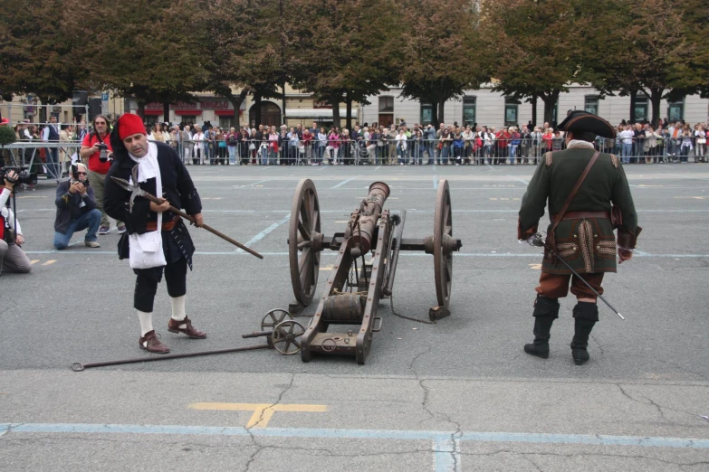 three men dressed in old times clothing are holding an axe